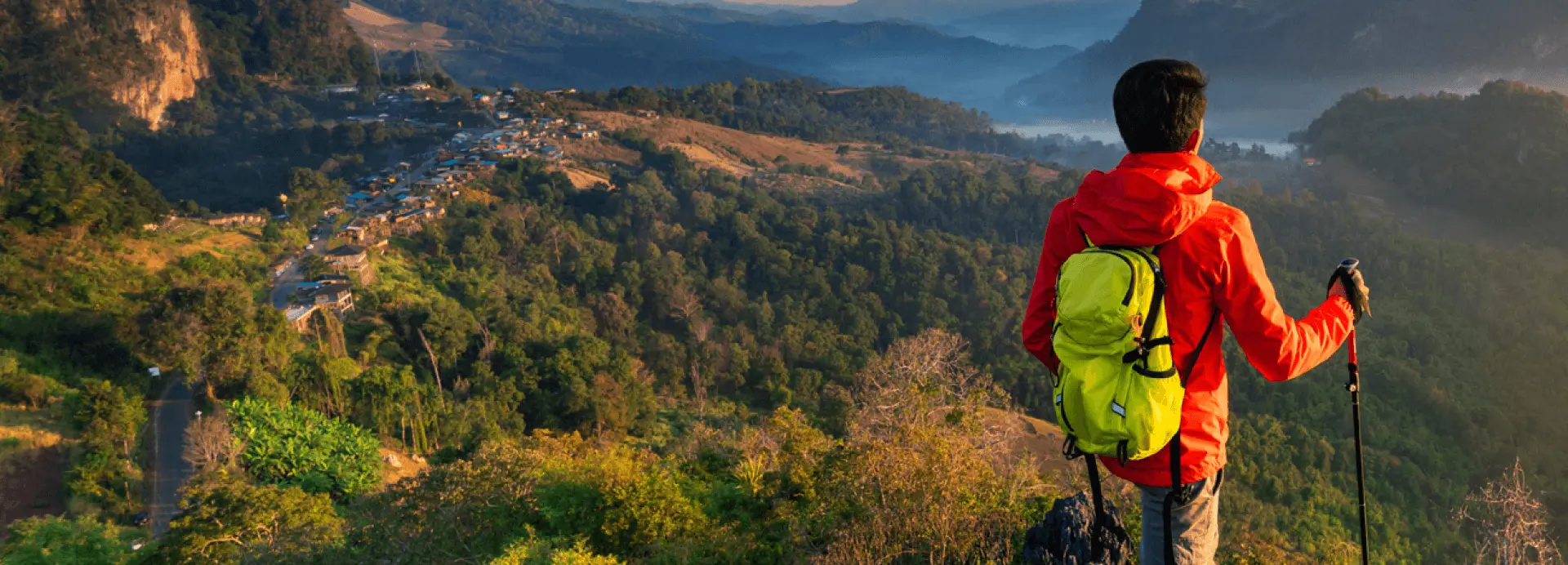 Man standing with hiking pole | Ease Trippers